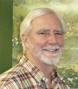 Smiling man with white hair and beard, portrait with green painted background