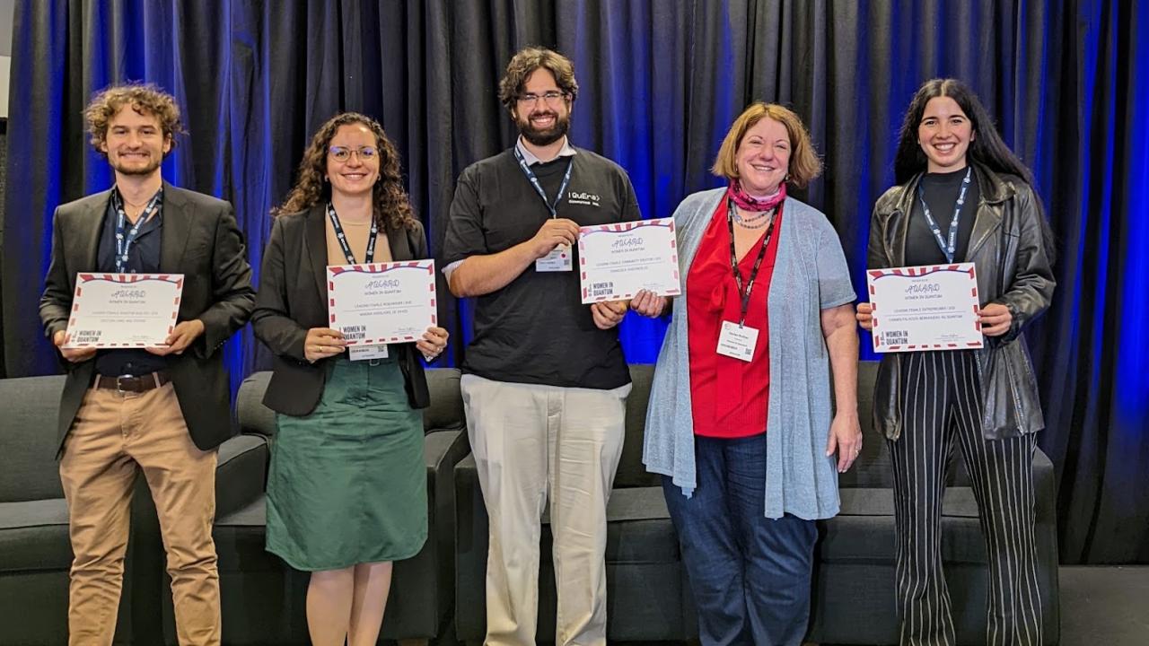Group of people holding up awards