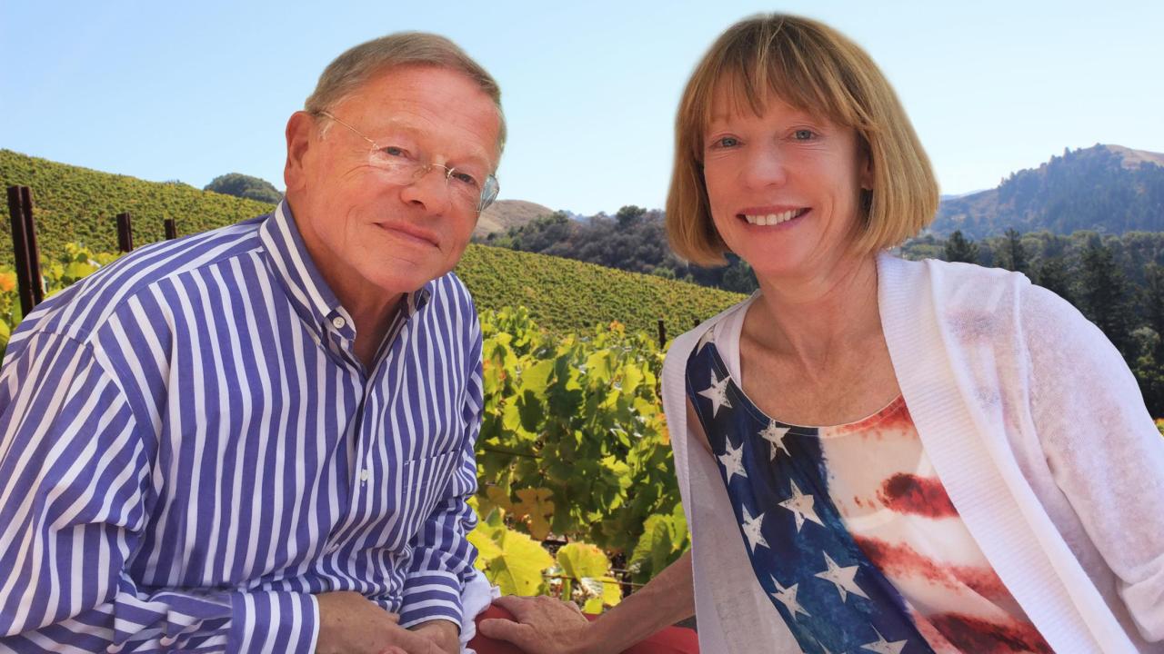 Dr. T.J. Rodgers and his wife Valeta Rodgers pose for a photo with vineyard in the background