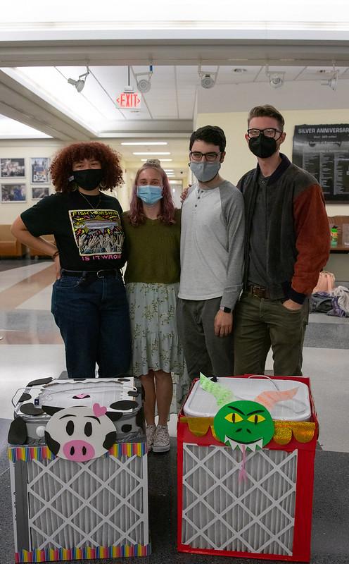 Students standing in front of decorated air filters