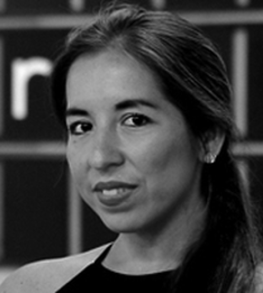 black and white headshot of Katia Vega smiling