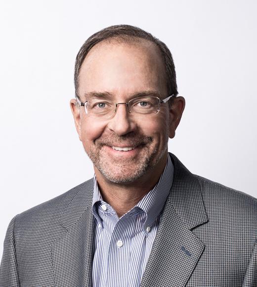image of man in glasses and blazer