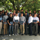 COSMOS program high school students gathered together under a tree