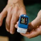 A device fits onto a human finger and displays numbers